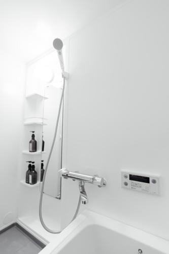 a bathroom with a sink with a faucet at 一軒家貸切 THREE FIELD Kobe Nakayamate in Kobe