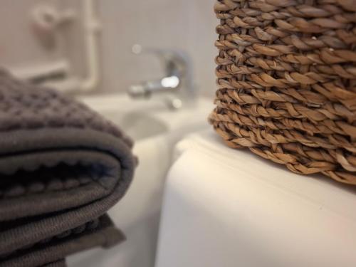 a pile of towels and a sink in a bathroom at Villa Josefine Lake Front beach and Pool in Brenzone sul Garda