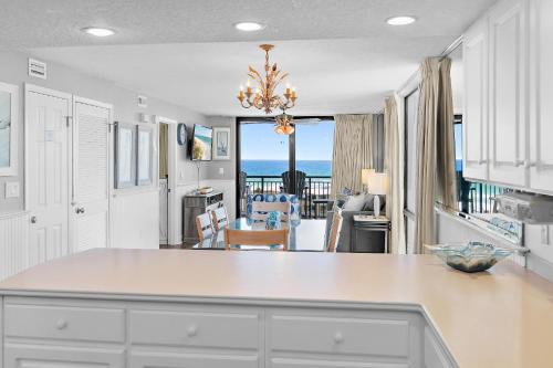 a kitchen with a view of the ocean at SunDestin 818 in Destin