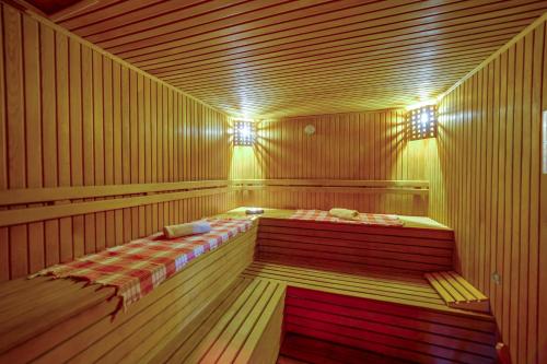 a sauna with two beds in the middle at Bodrum Fora Holiday Resort in Bodrum City