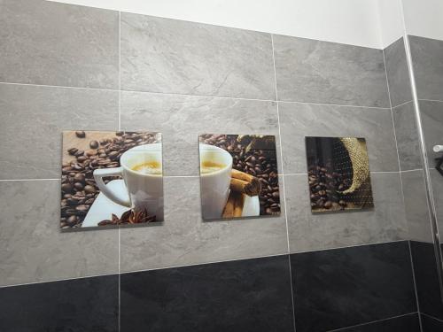 a picture of a cup of coffee on a wall at Appartamenti Lago di Como in Valbrona