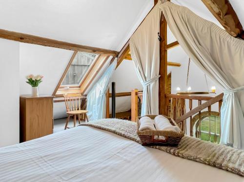 a bedroom with a bed in a room at Smiddy Cottage Hawkridge in Dulverton