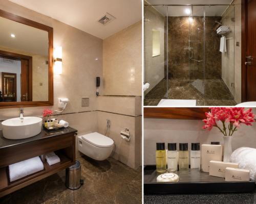 ein Badezimmer mit Waschbecken, Toilette und Dusche in der Unterkunft Down Town in Nathia Gali