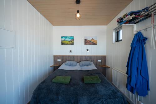 a bedroom with a large bed in a room at Grásteinn, guesthouse 2 in Grundarfjordur
