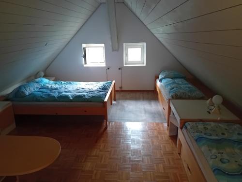 a room with two beds in a tent at Planinski dom Hermanov Hram in Log pod Mangartom