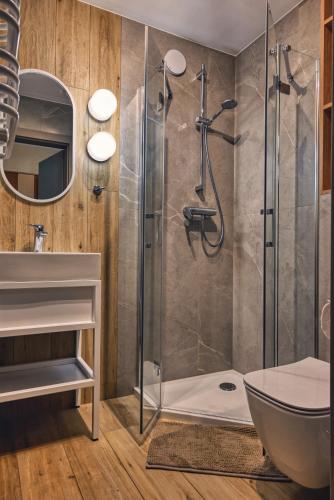 a bathroom with a shower with a glass door at Brido in Bardo