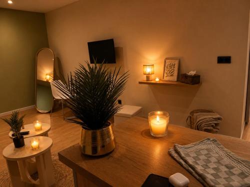 a living room with a table with candles on it at Côte-et-vins Gîte Le Cocon in Chagny