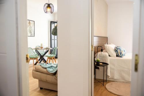 a living room with a couch and a table at La Calma apartamento muy cerca del centro in Cazorla