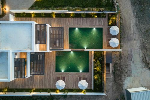 an aerial view of a backyard with a green lawn at SoleLuna - The Villas Project in Marmaroto