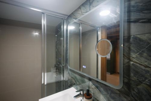a bathroom with a sink and a mirror at Casa do Javali 3 in Bragança