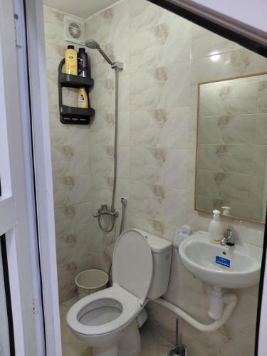 a bathroom with a toilet and a sink at Studio cozy 04 in Tangier