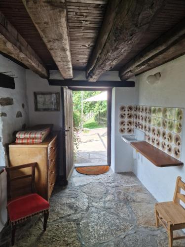 a room with a table and a chair and a door at Casa Grande in Falmenta