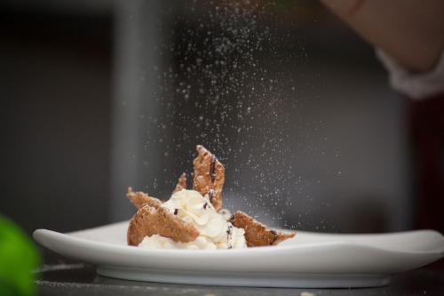 a plate of food with ice cream on a table at Feudo Vagliasindi -Wine Experience- in Randazzo
