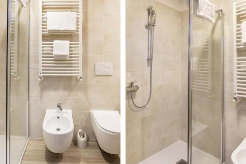a bathroom with a shower and a toilet and a sink at Park Hotel Jolanda in San Zeno di Montagna
