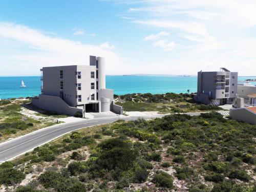 an aerial view of two apartment buildings on the beach at Crystal Lagoon Lodge in Langebaan