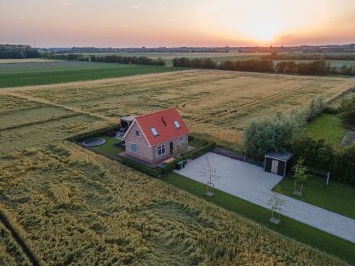 an aerial view of a house in the middle of a field at NIEUW Landzicht in Serooskerke