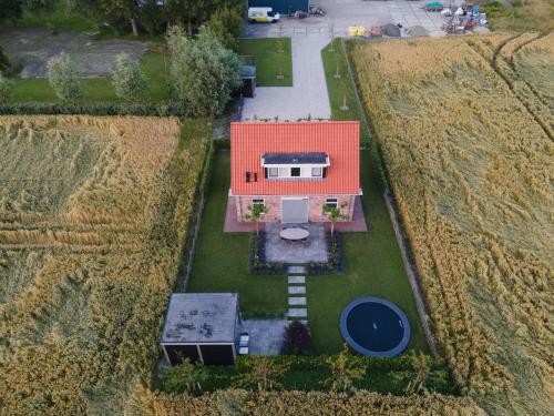 an aerial view of a house with an orange roof at NIEUW Landzicht in Serooskerke