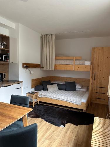 a bedroom with a bed and bunk beds at Apartment 225 in Forstau