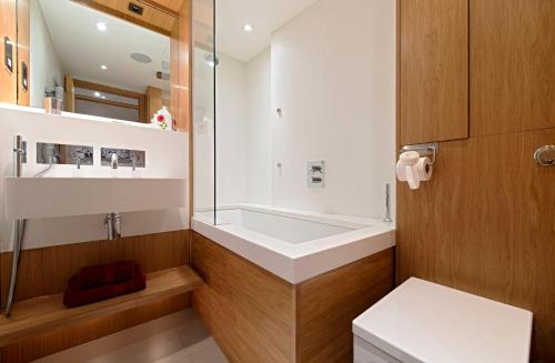 a bathroom with a white sink and a mirror at HomefromHolme St Peters Mews in St. Albans