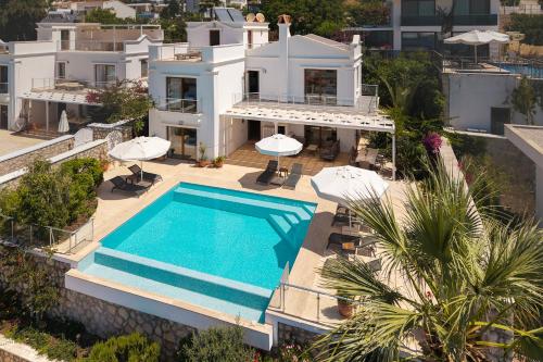 an aerial view of a villa with a swimming pool at Villa Yakamoz in Kalkan