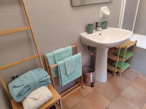 a bathroom with a sink and a toilet and a sink at Porta Del Ricetto in Candelo