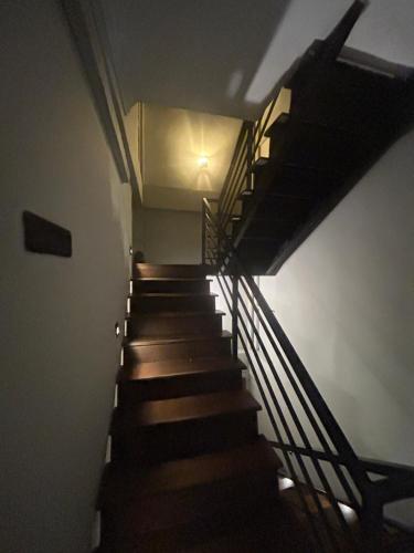 a stairway in a building with wooden stairs at Urban Vibe Kandy in Kandy