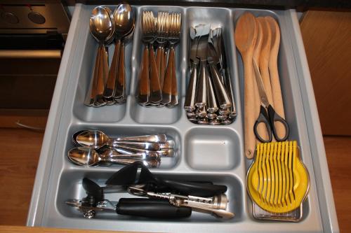 a tray filled with utensils and utensils at Ormurinn Guesthouse in Egilsstadir