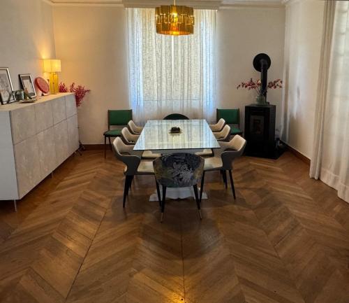 a dining room with a table and chairs at Bellavita in Courpière