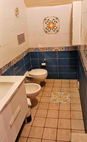a bathroom with a toilet and a sink at La MARUZZELLA in Vietri sul Mare