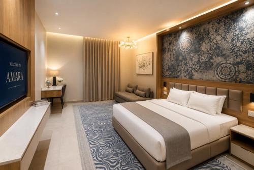 a hotel room with a bed and a television at Abu Rakan Apartment in Muscat