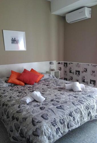 a bedroom with a large bed with towels on it at B&B Sweet Home Two Steps From The Ruins... in Pompei