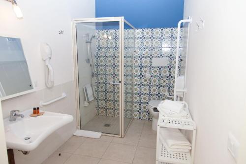 a bathroom with a shower and a sink at Feudo Vagliasindi -Wine Experience- in Randazzo