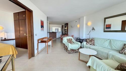 a living room with a couch and a table at MEDES PARK II 4-3 in L'Estartit