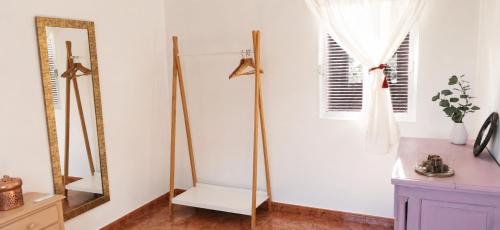 a room with a mirror and a dresser at La Pizpireta in Cazorla