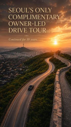 a car driving down a road at sunset at Friendly DH Naissance Hotel by Mindrum Group in Seoul