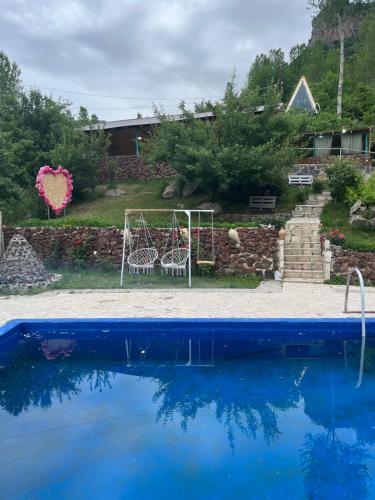a wedding set up by a pool in a backyard at Green Garden in Alayaz