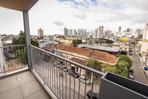 a balcony with a view of a city at Studio Piedade 45 | More do seu jeito in Belém