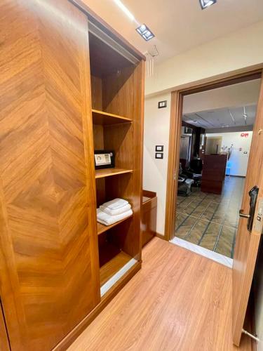 a room with a wooden door and a hallway at Montaza City in Alexandria