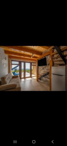 a living room with a couch and a tv in it at Petar in Kalnik