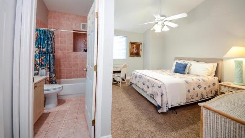 a bedroom with a bed and a bathroom at 207 Mariners Club in Key Largo
