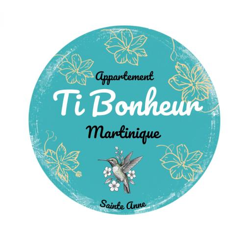 a sign for a tb bournemouth mariculture shop at Lodge Ti Bonheur in Sainte-Anne