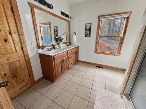a bathroom with a sink and a mirror at Mountain Views, Game Room, Firepit Near Wineries in Cleveland