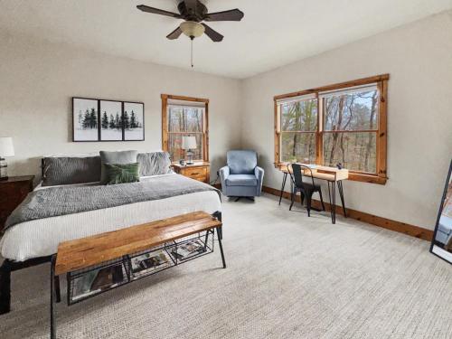 a bedroom with a bed and a fan and a chair at Mountain Views, Game Room, Firepit Near Wineries in Cleveland