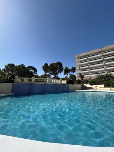 a large swimming pool in front of a building at Cozy Apartment with Pool at 5 Min to Beach in Salou