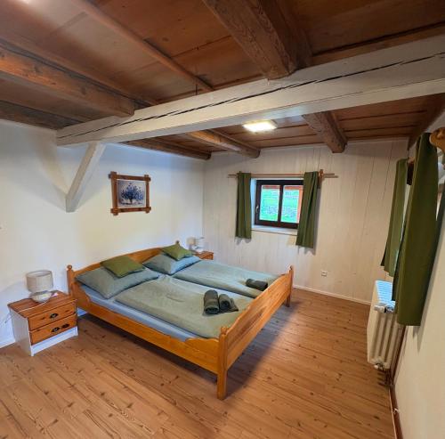a bedroom with a large bed in a room at Apartmán na statku in Teplice