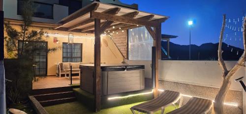 a backyard with a gazebo and a table and chairs at Bella Vista 234 in Lajita
