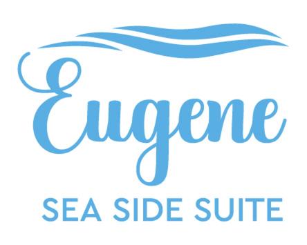 a logo for a sea side surf shop at Eugene Sea Side Suite in Naousa