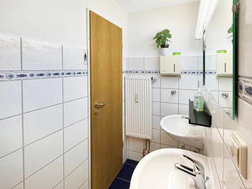 a bathroom with a sink and a toilet at Gruppenloft Stuttgart Kicker & 14 Gäste in Stuttgart