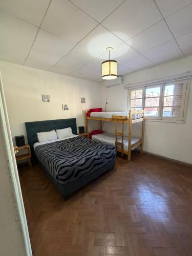 a bedroom with a bed and a table in it at Casa LYON in Barraquero