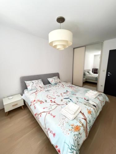 a bedroom with a bed and a large mirror at GALAXY apartment in Sofia